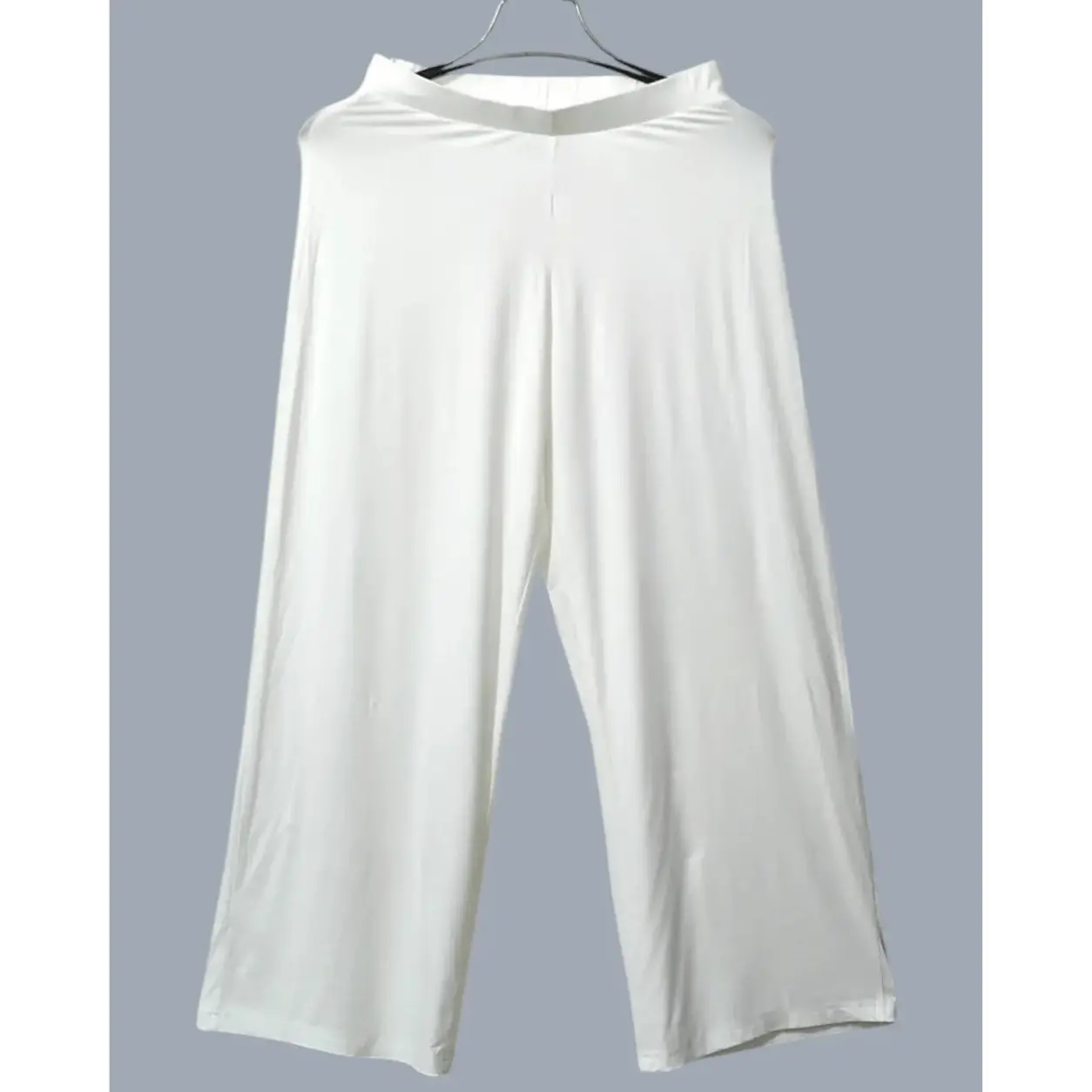 Off-white soft-drape wide-leg pants in viscose knit, styled with nude strappy heels – Lillithe