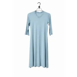Woman wearing Lillithe Serene Lace-Trim Midi Dress in muted powder blue with V-neck lace detail and 3/4 sleeves, styled with a printed dupatta.
