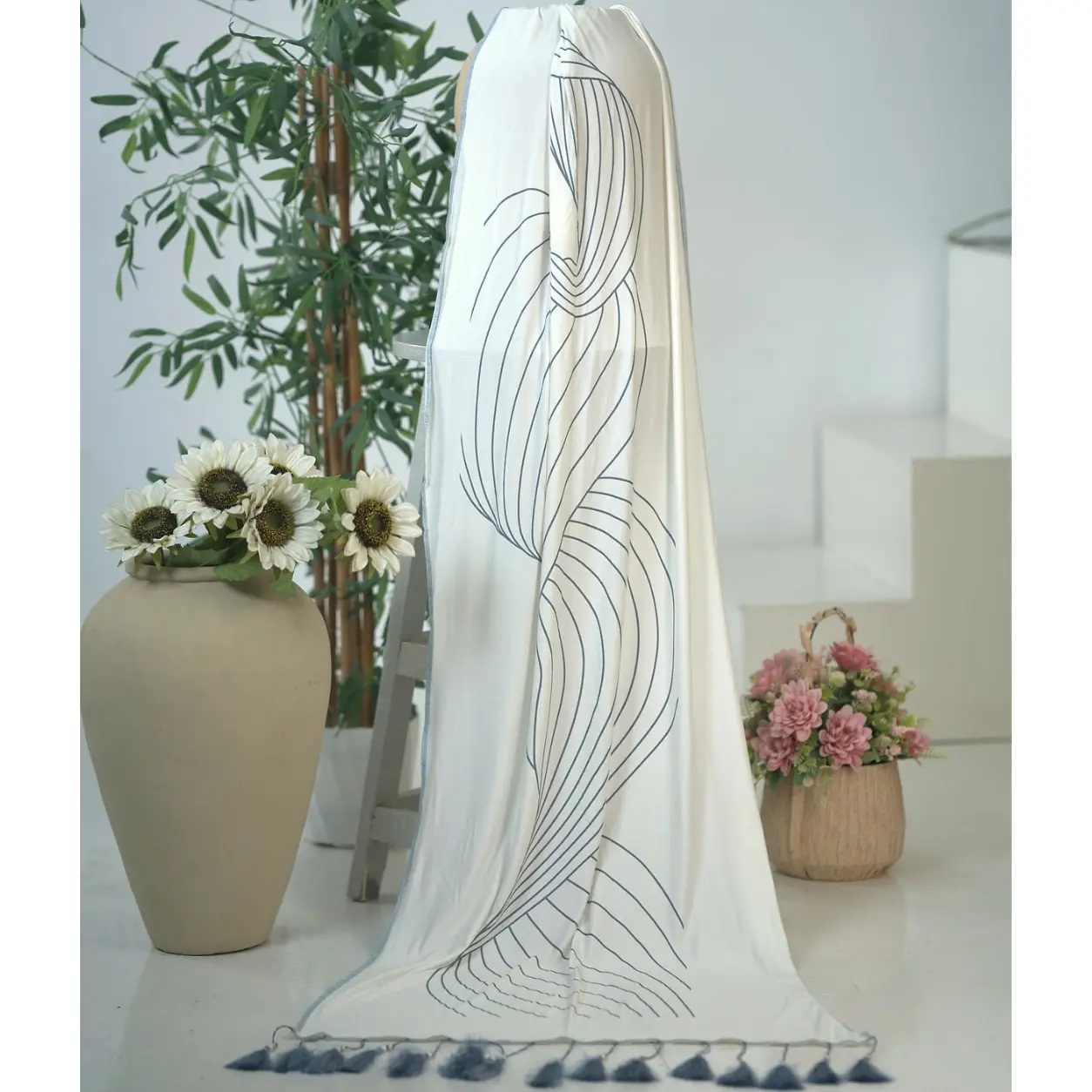 Off-white Linear Wave Dupatta in viscose knit with grey wave line print and tassels, draped for display – Lillithe