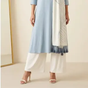 Linear Wave Dupatta – Off White Off-white Linear Wave Dupatta in viscose knit with grey wave line print and tassels, draped for display – Lillithe