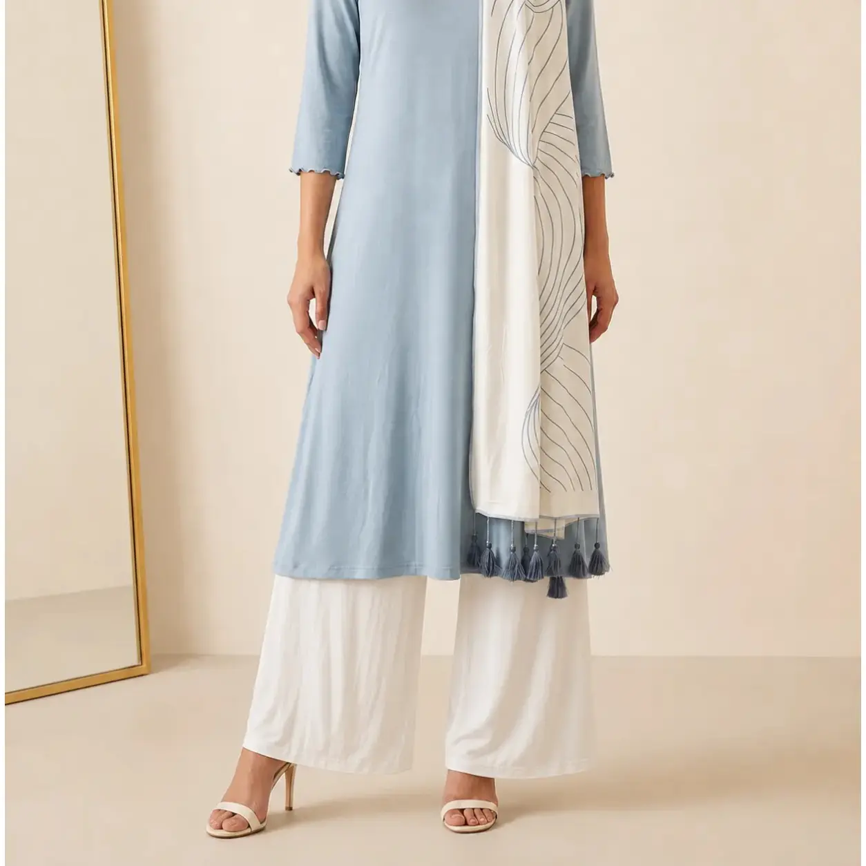 Off-white soft-drape wide-leg pants in viscose knit, styled with nude strappy heels – Lillithe